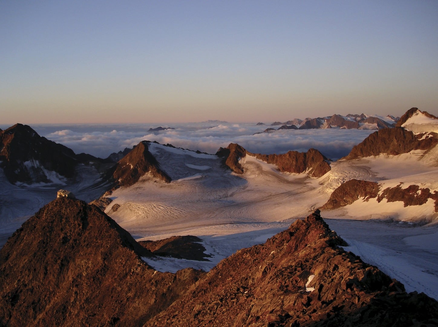South Tyrolean mountain peaks with snow and clouds