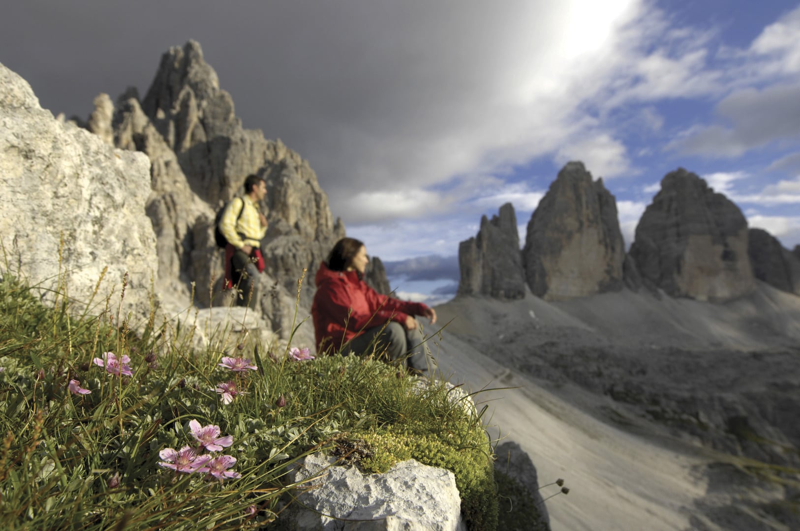 Two mountaineers in front of the Tre Cime di Lavaredo (Three Peaks).