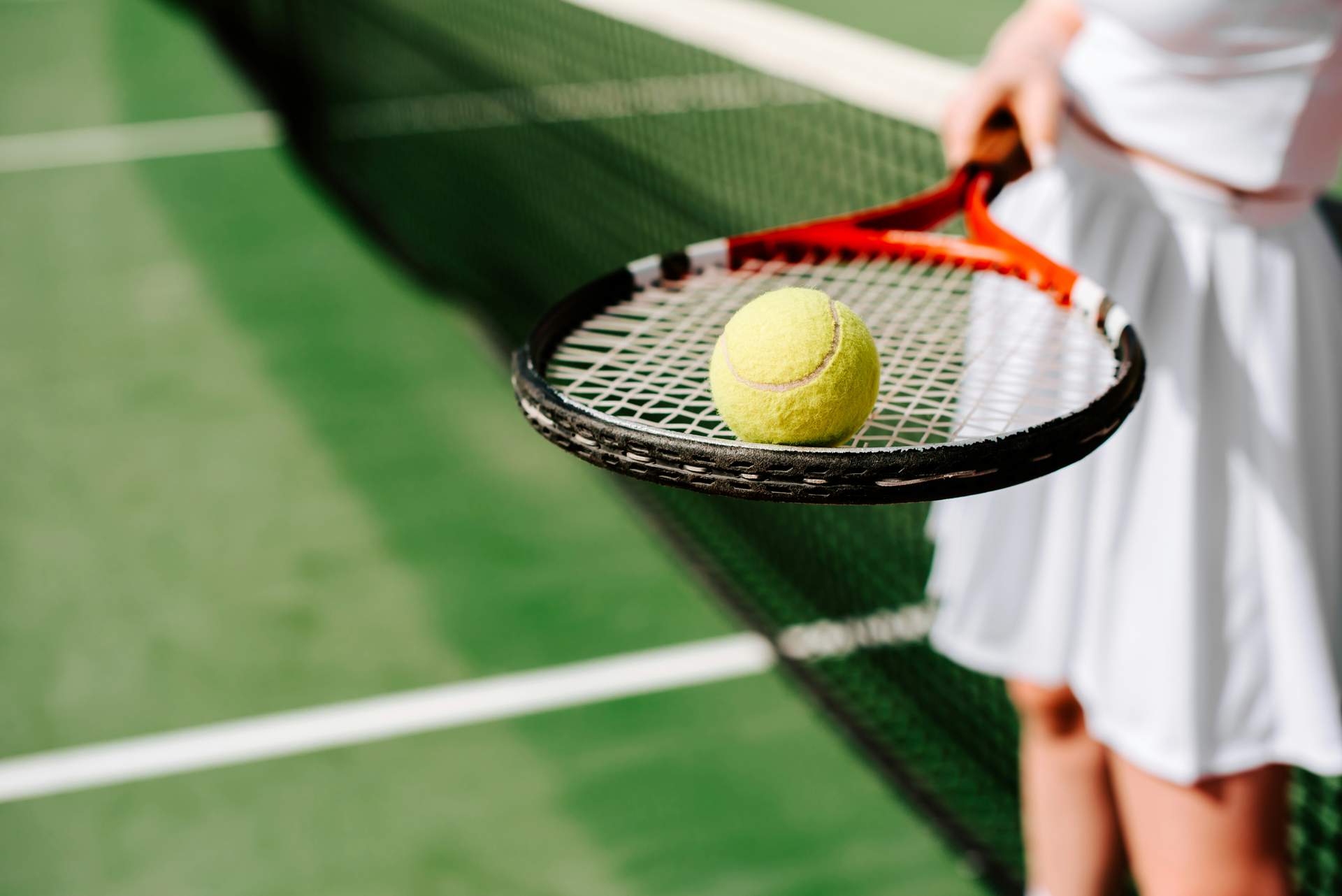 Tennisball auf dem Schläger